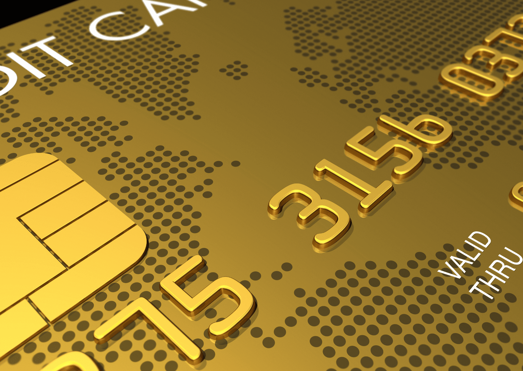 T&eacute;l&eacute;phone, carte bancaire et ordinateur sur un bureau